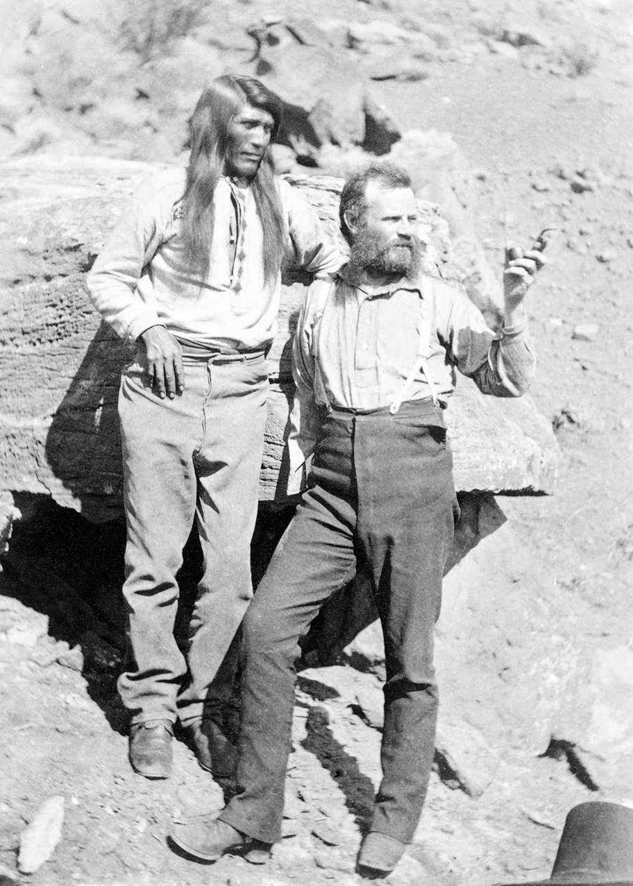 Tau-Gu, chief of the Paiutes, overlooking the Virgin River with J.W. Powell, age 39, circa 1873
